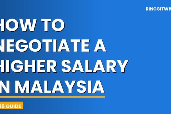 Malaysian professional confidently negotiating a higher salary across a desk in a modern KL office